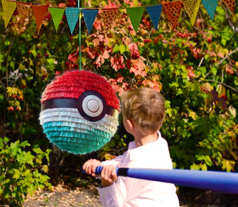 Pokémon pinata, boy hitting pinata with a club on his birthday party.